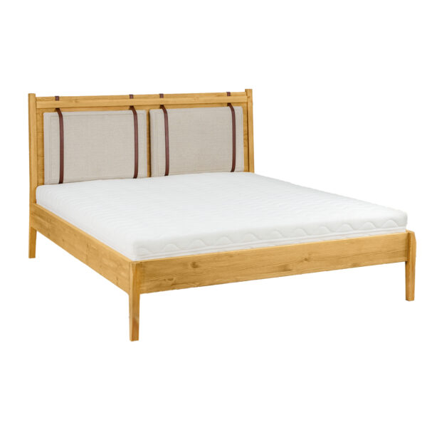 Drewniane łóżko z tapicerowanym wezgłowiem